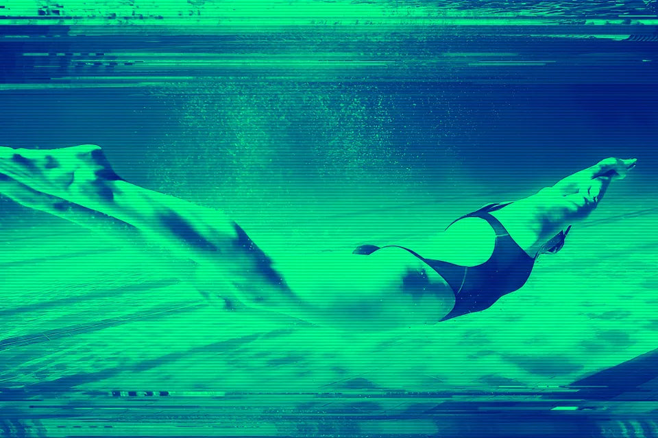Swimmer driving forward underwater